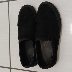 Vans black flocked roses slip on